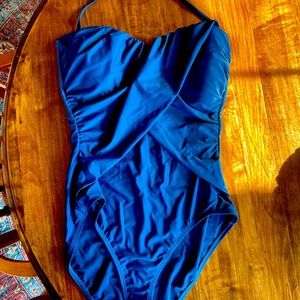 New, never worn (tags removed,) slimming, stunning steel blue one piece suit.